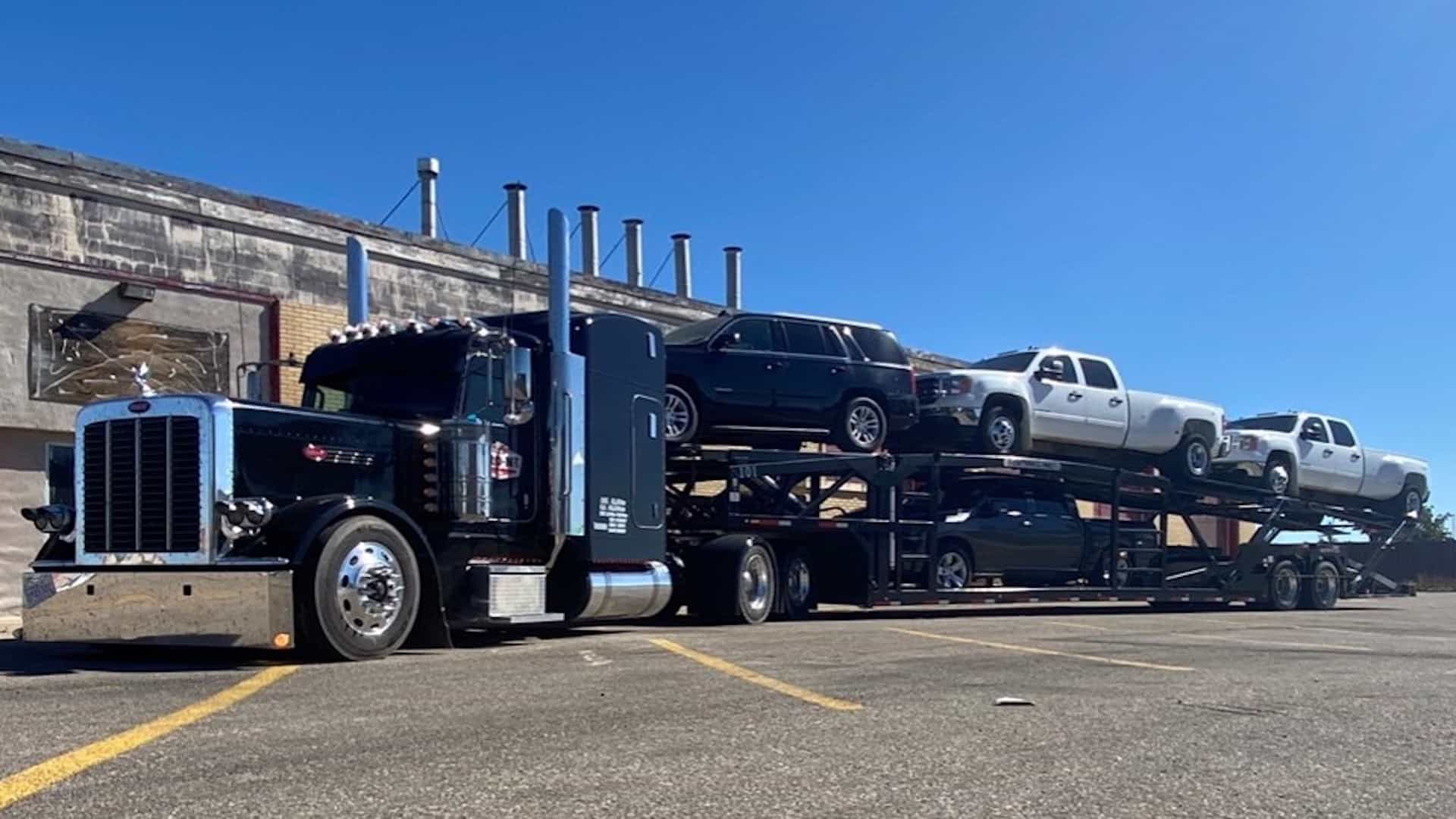A ProN2 truck hauling two decks of cars